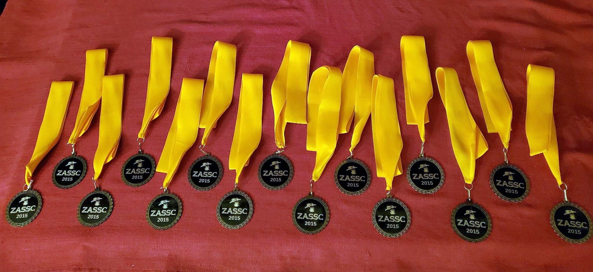 The ZASSC medallions on orange ribbons, each stamped 2015.